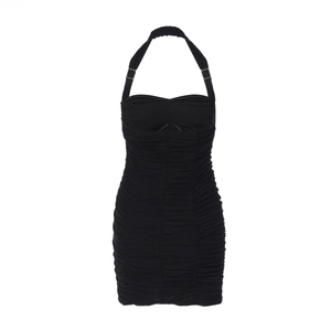 Close-up of black backless halter dress with elegant ruched fabric detailing