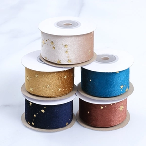 Five rolls of velvet ribbons with gold star foil print in assorted elegant colors