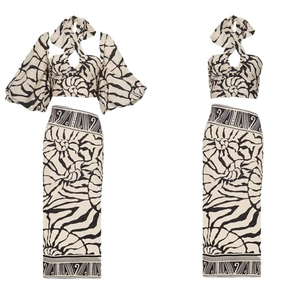 Two-piece bohemian set with halter puff sleeve top and printed high waist maxi skirt