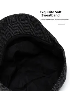 Detail of soft cotton sweatband and herringbone tweed texture inside the newsboy cap