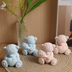 Detail of 3D bear candle silicone molds with textured lamb wool surface and heart shapes