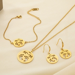 Detail of gold stainless steel MOM jewelry set with necklace, bracelet and earrings