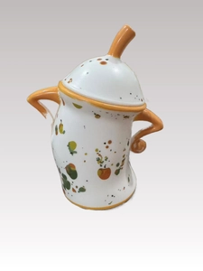 Detail of hand-painted white ceramic sugar canister with orange handles and dots