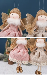 Détails rapprochés d'ornements d'anges en tissu rose et beige avec ailes dorées