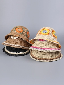 Collection of five handmade crochet summer hats in various floral and striped patterns