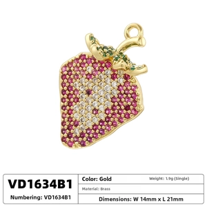 Macro view of gold brass strawberry pendant with red crystals and dimensions table