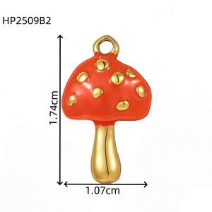 Detailed view of red mushroom pendant with gold spots and measurements 1.74cm by 1.07cm
