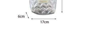 Detail of silver quilted storage bag showing 17cm by 6cm bottom dimensions and logo