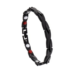 Detail of black magnetic link bracelet showing red and white health care stone inserts