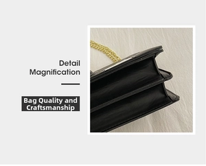 Macro detail magnification of black leather handbag featuring gold chain and accordion folds