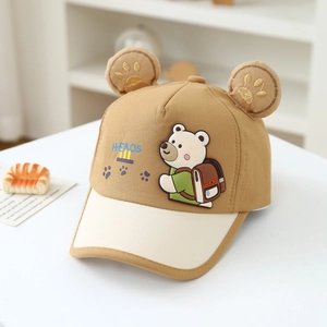 Detail of cartoon bear embroidery and 3D ears on a khaki-beige kids baseball cap