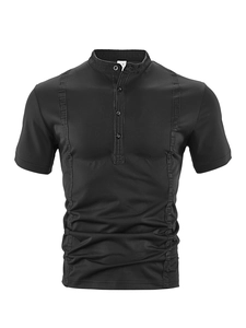 Detail of short sleeve polo shirt collar with buttons and size M tag on black knit fabric
