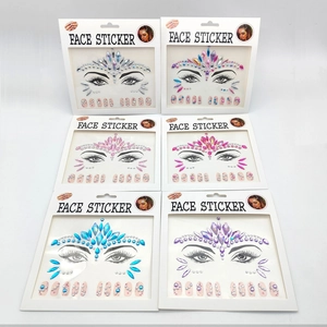 Macro view of six colorful acrylic rhinestone face and nail sticker sets for music festivals