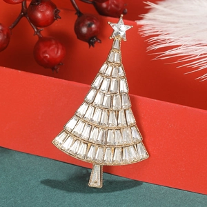 Detailed close-up of crystal Christmas tree brooch with gold base and sparkling rhinestones