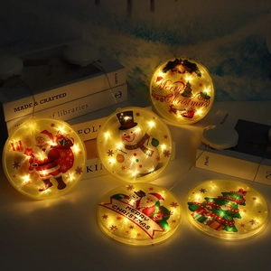 Warm yellow Christmas LED hanging lights with Santa and reindeer patterns in round shape