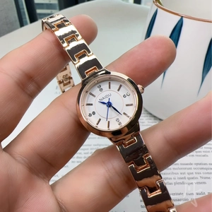 Elegant rose gold women's quartz watch with blue hands and diamond-set white dial
