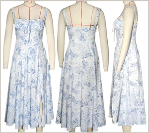 Detailed view of white floral sun dress with blue prints, side slit and smocked bust detail