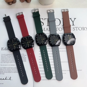 Flat lay of five square quartz watches with silicone straps in various elegant colors