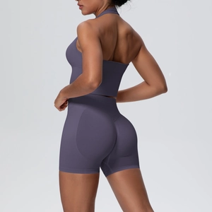 Close-up of seamless yoga set with halter open-back top and high-waist shorts
