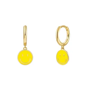 Detailed close-up of S925 sterling silver hoop earrings with yellow enamel smiley face charm