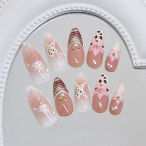 French blush press-on nails with 3D starfish, pearls, and floral art on almond shape