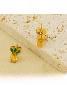 Macro view of 18k gold plated titanium steel pineapple stud with yellow zircon stone
