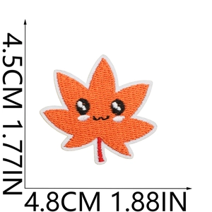 Macro detail of cartoon maple leaf embroidery patch with 4.5cm size dimensions