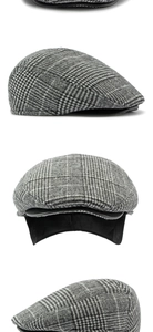 Detail view of grey Glen Check newsboy cap with warm lining and premium wool texture