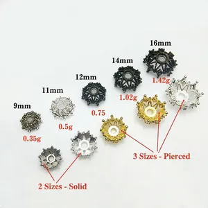 Detailed view of hollow patterned alloy flower bead caps in bronze silver and gold