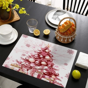 Pink Christmas tree placemat with snowflakes on dark wood table for holiday decor