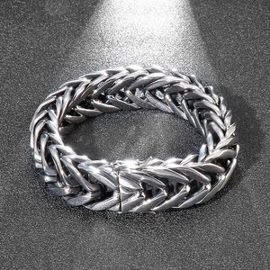 Macro shot of punk style stainless steel V-shaped chain bracelet for men in silver finish