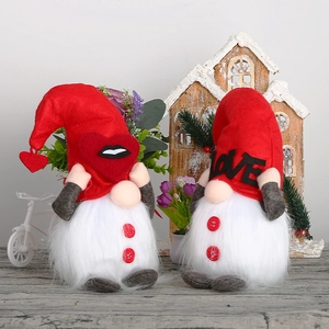 Pair of glowing Valentine's Day Gnomes with LOVE letters and heart heart motifs on wood