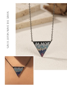 Detail of S925 silver triangle necklace featuring rows of colorful rhinestones