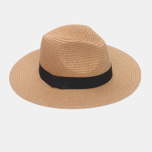 Close-up of the delicate woven texture and black ribbon detail on this straw Panama hat