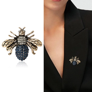 Vintage bronze bee brooch with blue gemstones and white rhinestones for suits