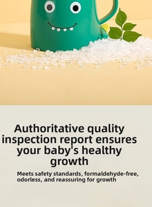 Close-up of green dinosaur kids cup with food-grade PP plastic raw material granules
