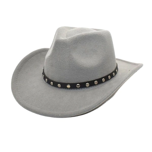 Detail view of a grey felt cowboy hat featuring a black leather band with silver metal studs