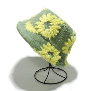 Winter teddy fleece bucket hat in sage green with yellow sunflower patterns