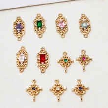Detailed view of copper gold-plated rectangular pendants with colorful zircon inlays