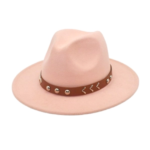Detail of pink wool fedora with brown leather band and silver metal rivet accents