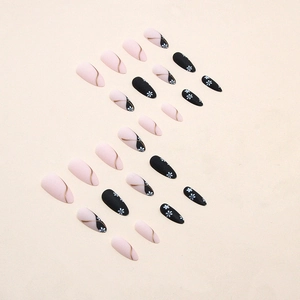 Matte almond press-on nails with white flower patterns and elegant gold curved lines