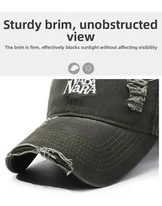 Detailed embroidery on distressed army green denim baseball cap with frayed brim