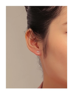 Minimalist S925 silver curved stud earring with micro-pave cubic zirconia on ear