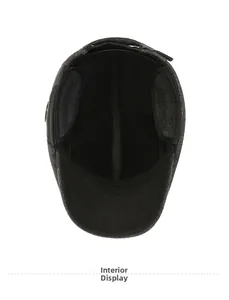 Detail view of the warm interior lining and ear flaps of a winter flat cap for men
