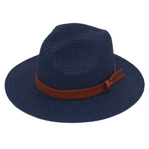 Navy blue straw fedora hat with brown leather band accessory for beach and leisure style