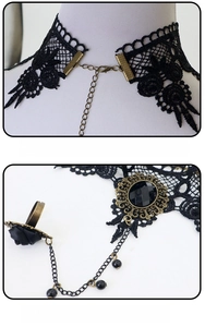 Detail of adjustable lobster clasp and rose lace bracelet with ring set in gothic style