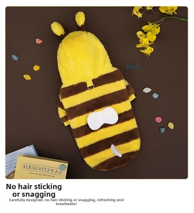 Detail of plush bee pet costume with soft striped fabric and cute decorative wings