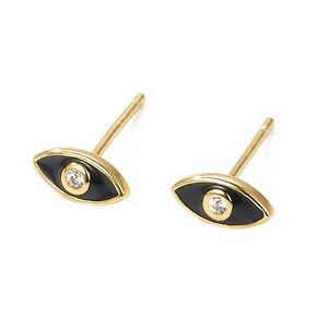 Detailed macro view of small gold evil eye stud earrings with black enamel and zircon