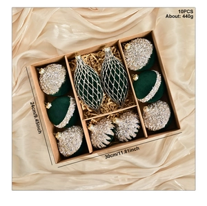 Detail of 10pcs green and silver flocked Christmas ball set in luxury gold silk box