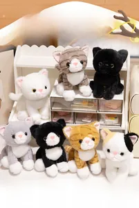 Detail view of 7 assorted lifelike plush cat keychains in various colors and soft fur